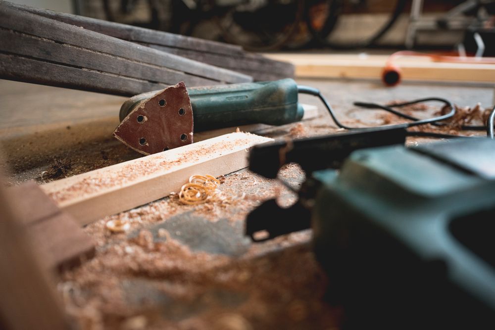 A wall of chisels, saws and marking gauges hung above the bench in the joinery shop