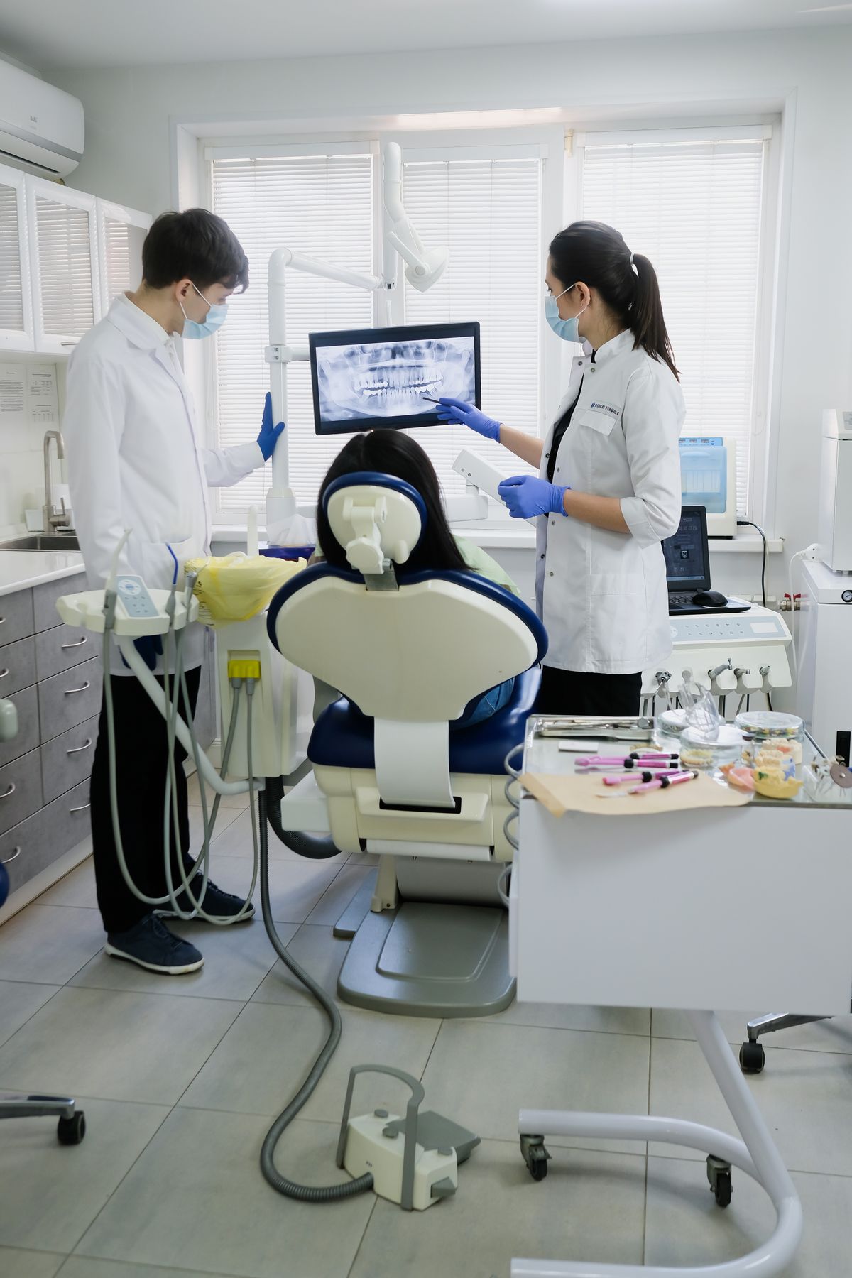A dentist and assistant working together during a patient appointment