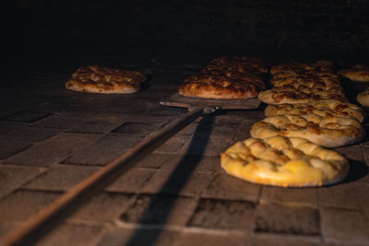 Golden loaves in the stone deck oven