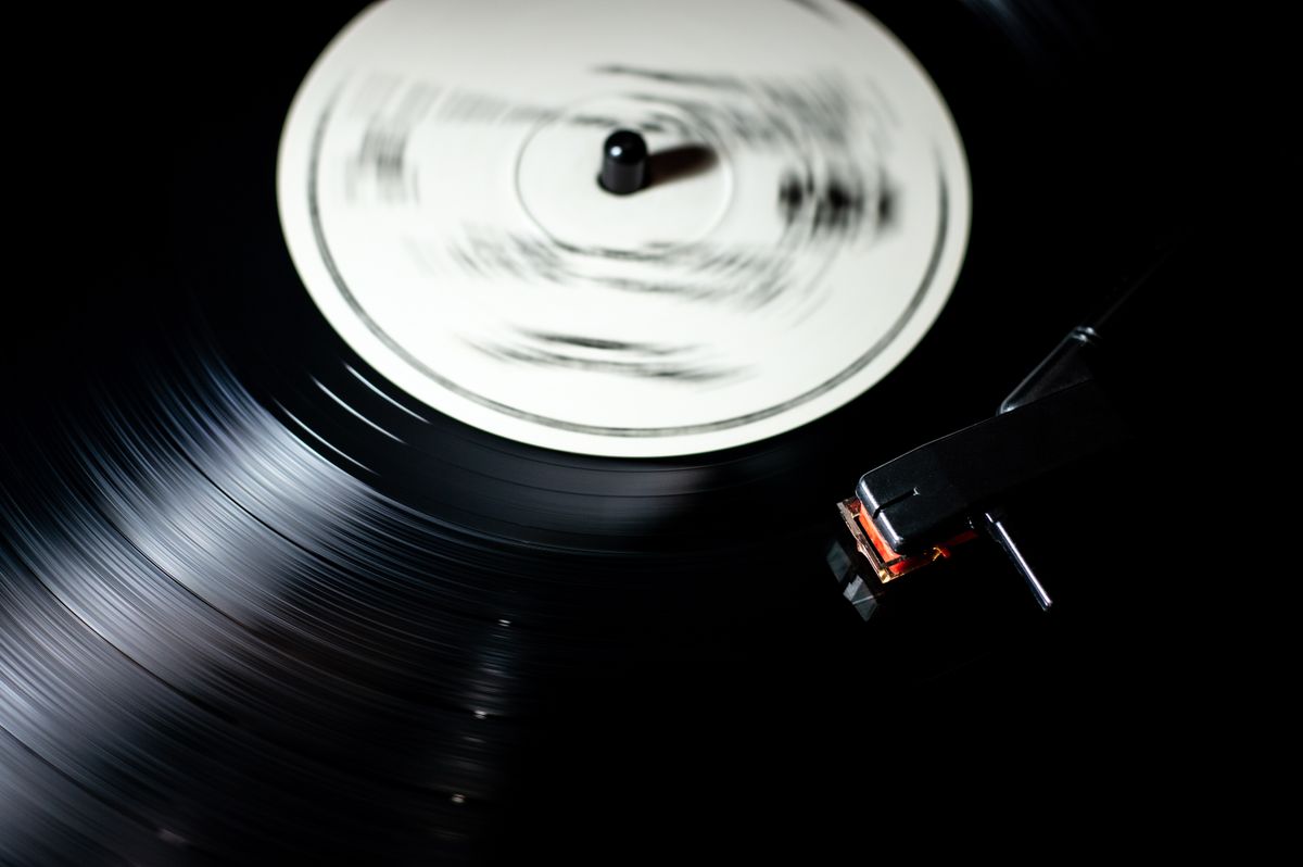 A record turning under the needle on a turntable